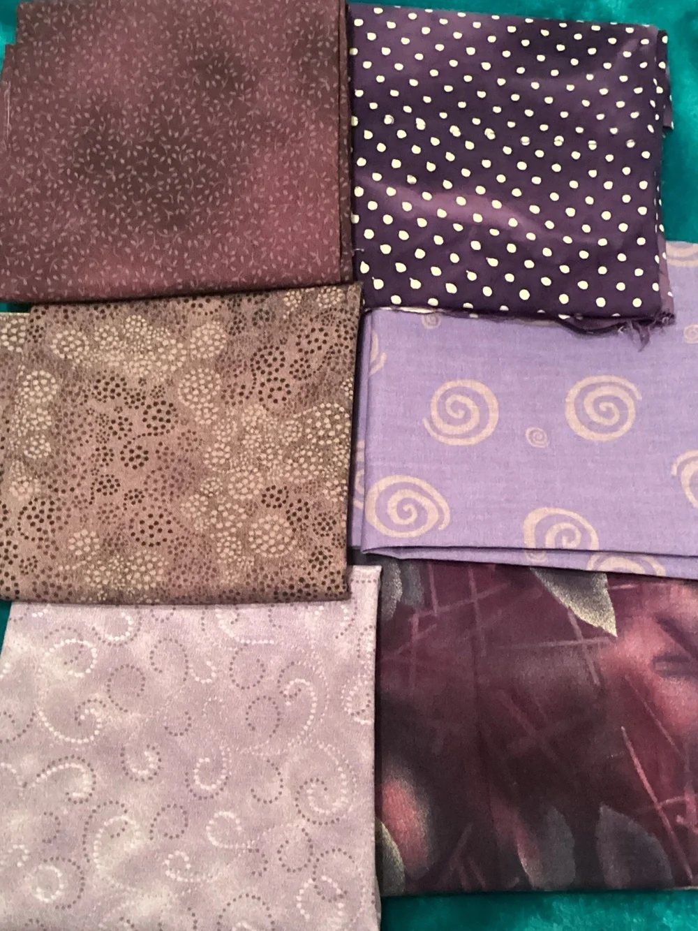 Assorted purple fabrics